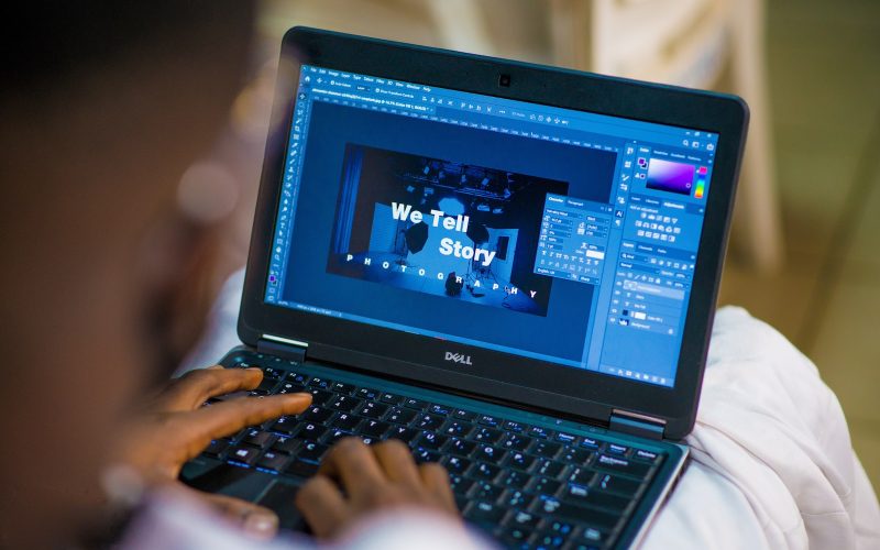 person using black laptop computer